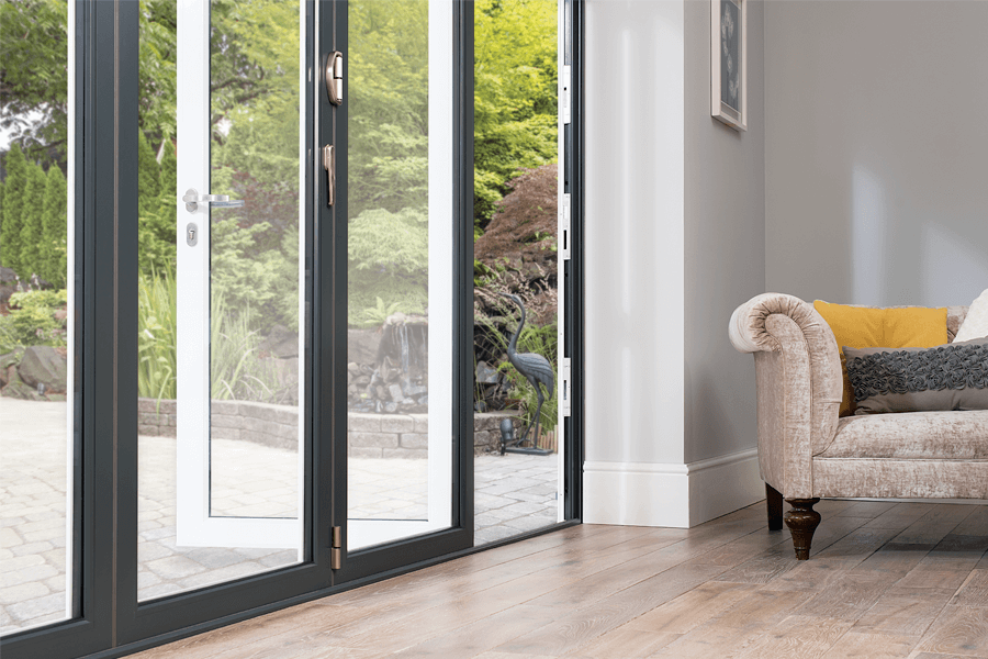 aluminium bi-fold doors that are grey on the interior close up