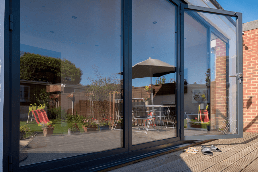 aluminium black bi-fold partially opened door exterior