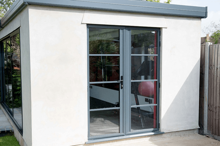 Aluminium black french door on a white walled conservatory