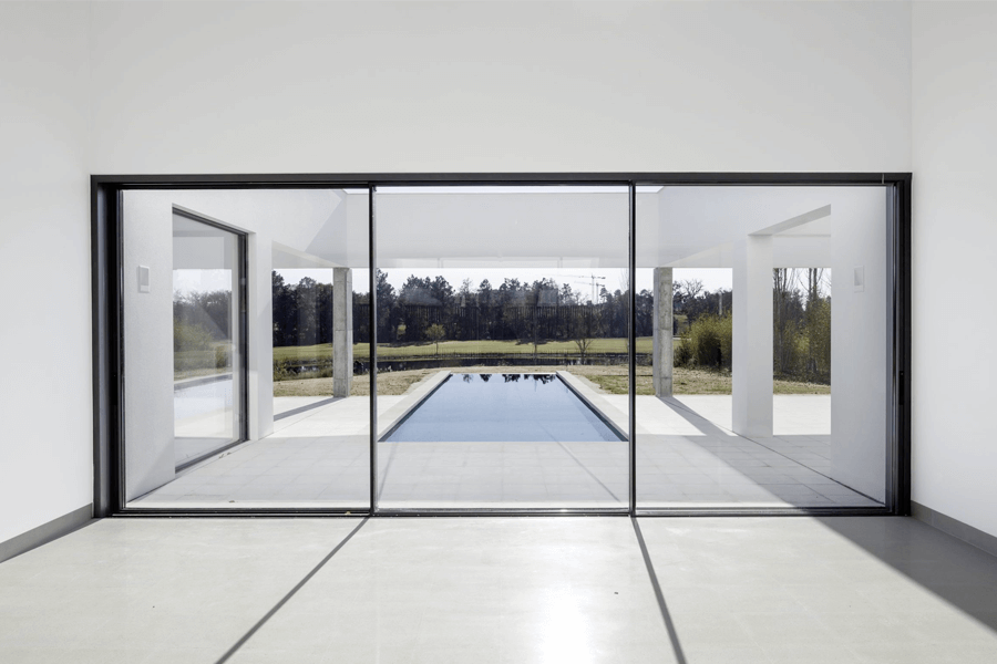 Aluminium black sliding doors interior white room