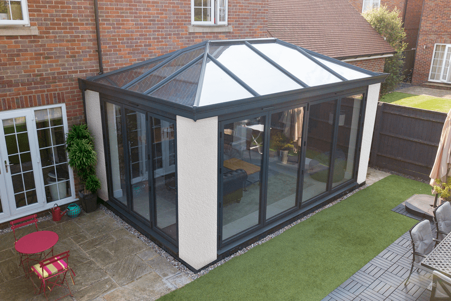 orangery with white piliers black aluminum glass roof
