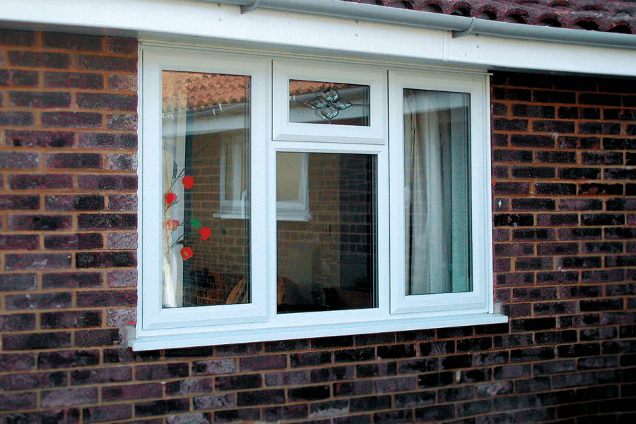 white uPVC casement window decorative on a red brick bungalow