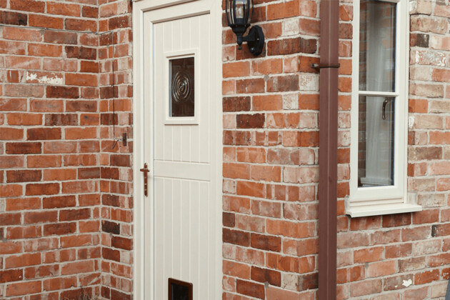 entrance door cream uPVC with a cat flap