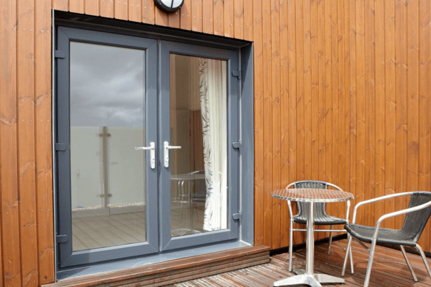 french doors anthracite grey with oak panel walls