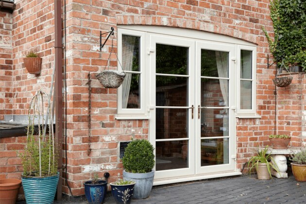 cream uPVC french doors with casement windows on the side