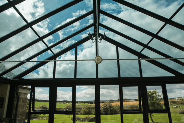 glass roof gable dark navy grey aluminium and uPVC conservatory interior