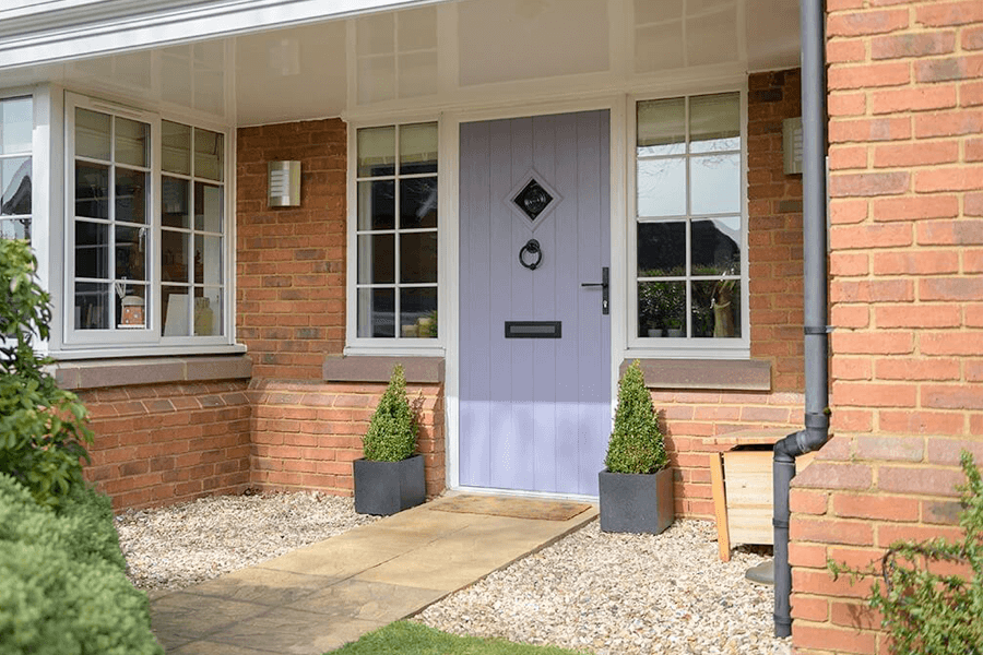 purple composite door with white uPVC windows