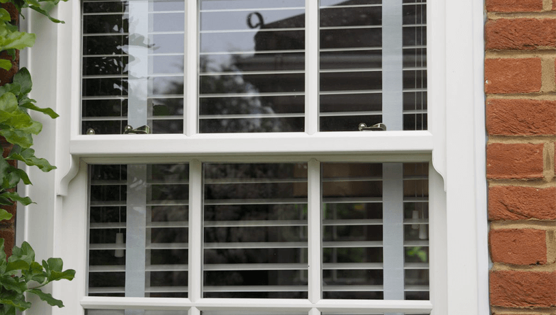 white uPVC sliding sash window close up