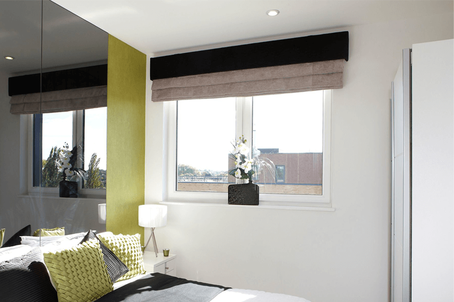 white uPVC tilt turn window bedroom interior with blinds