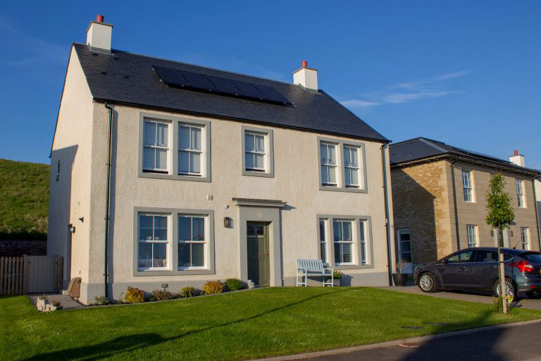 large house with sliding sash windows